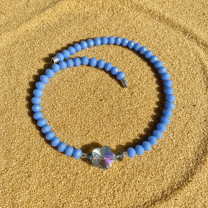 Blue butterfly sand